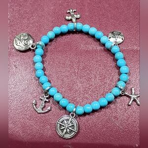 Hand Crafted Acrylic Turquoise Beaded Bracelet with Silver Charms